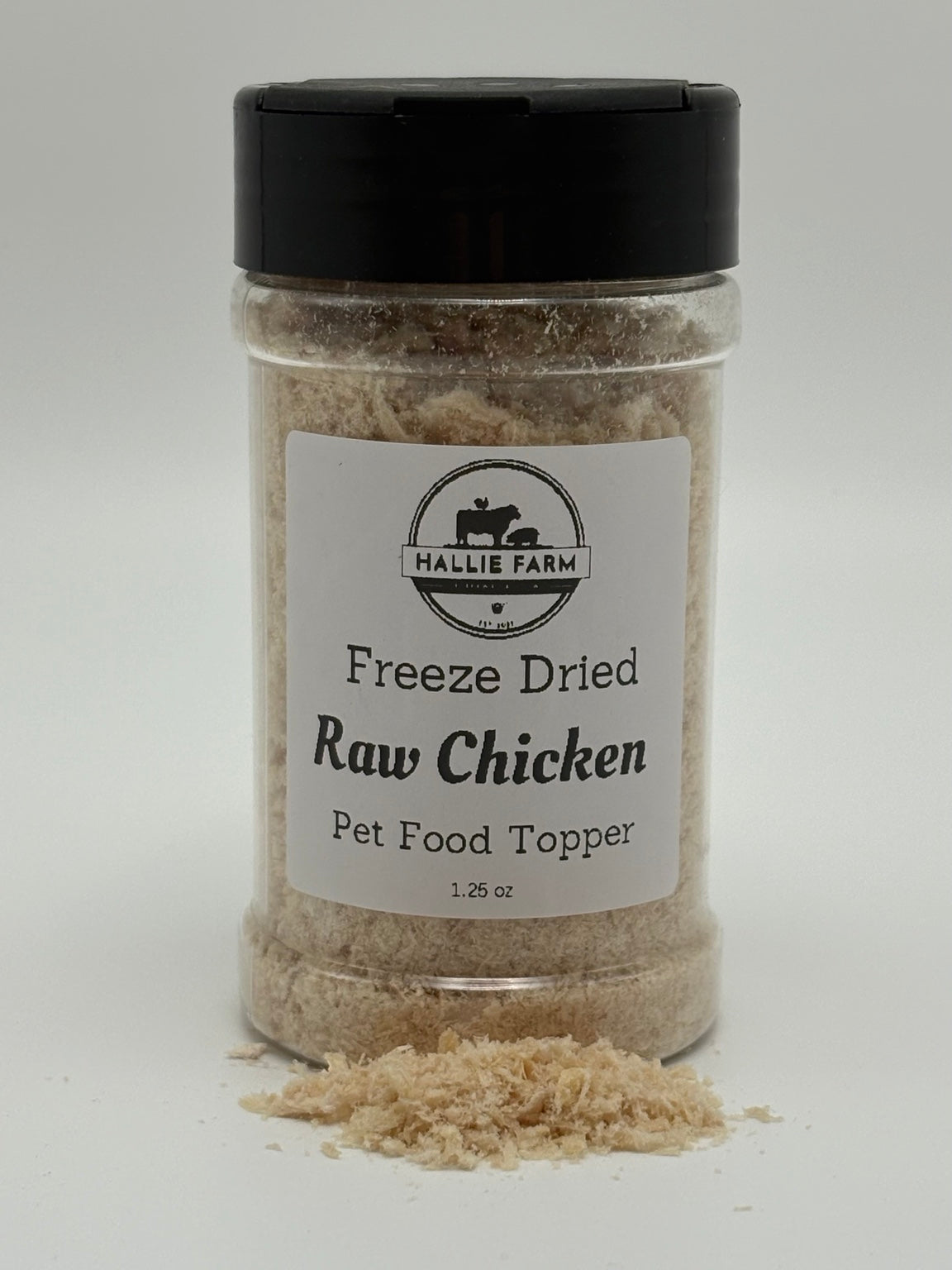 Hallie Farm 1.25 oz freeze-dried chicken pet food topper jar with loose shredded chicken topper in front